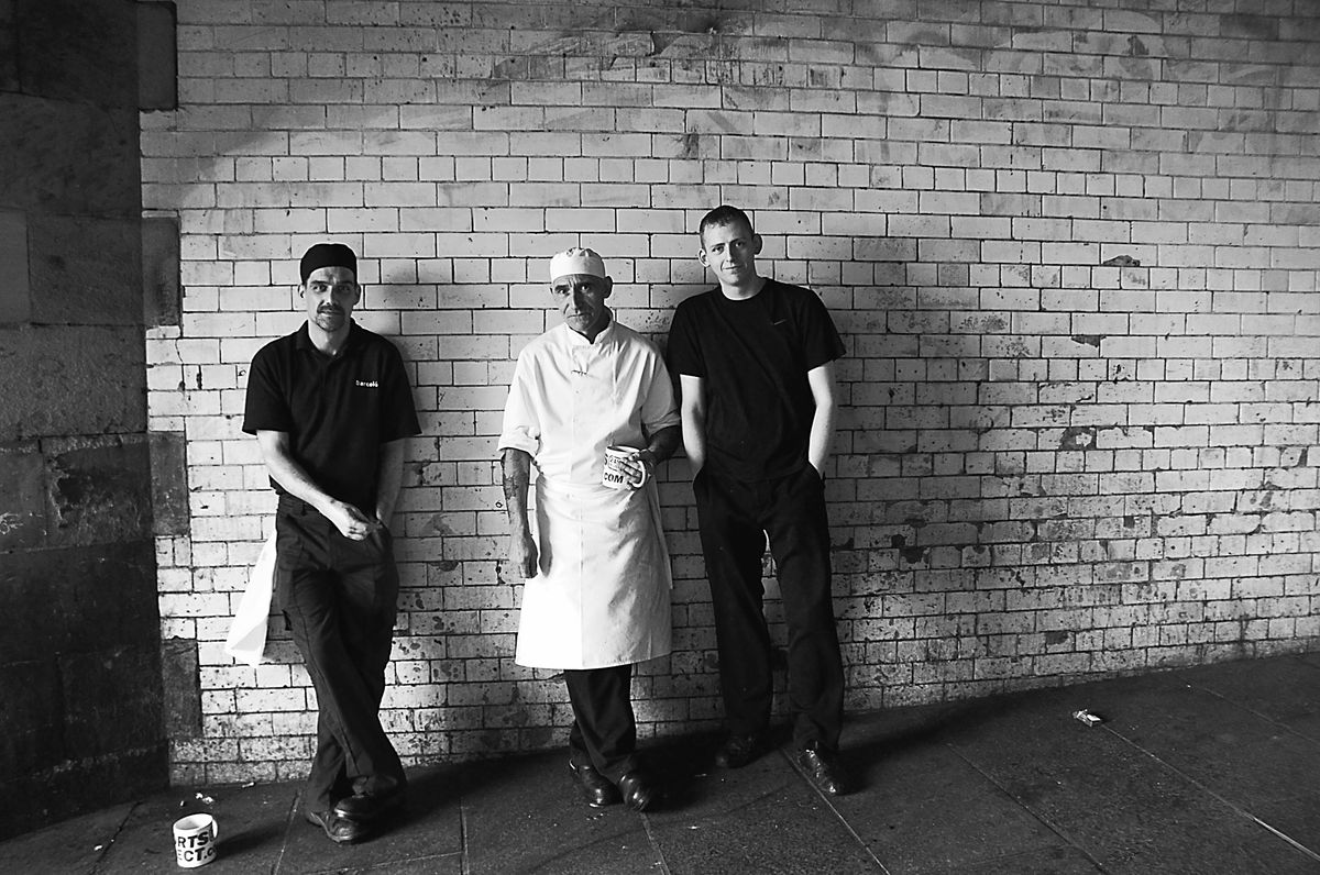 Sunday morning in central Edinburgh, three hotel kitchen staff step outside for a break.