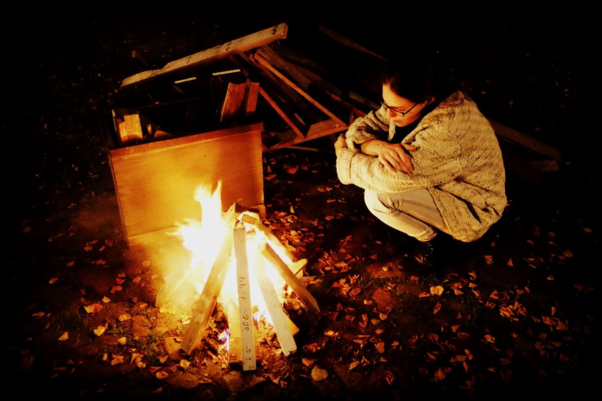 Girl watching a fire.