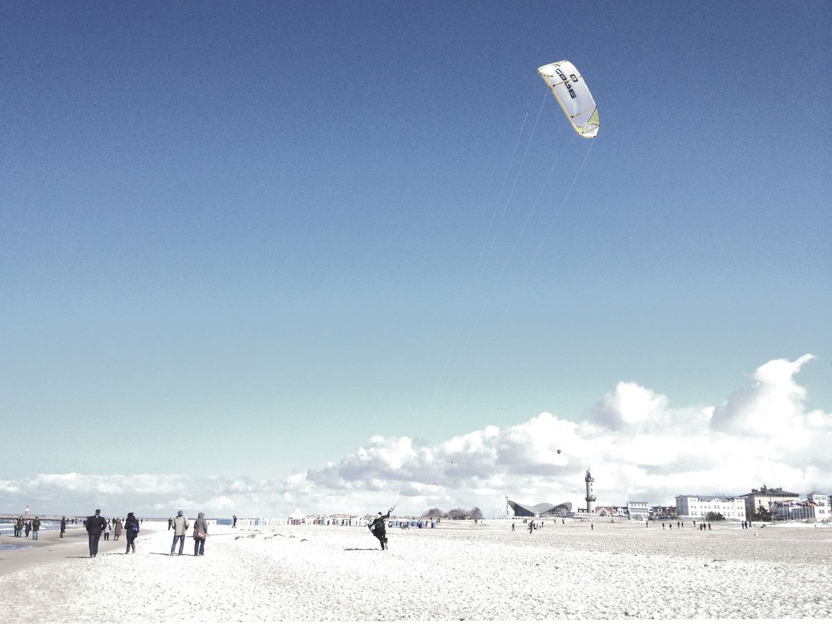 mobile snapshot. One of the first days after a long cold and very grey winter. Baltic Sea, Rostock. The photo completely captured the moment of enthusiasm and revitalization of the people in the warming sunlight.