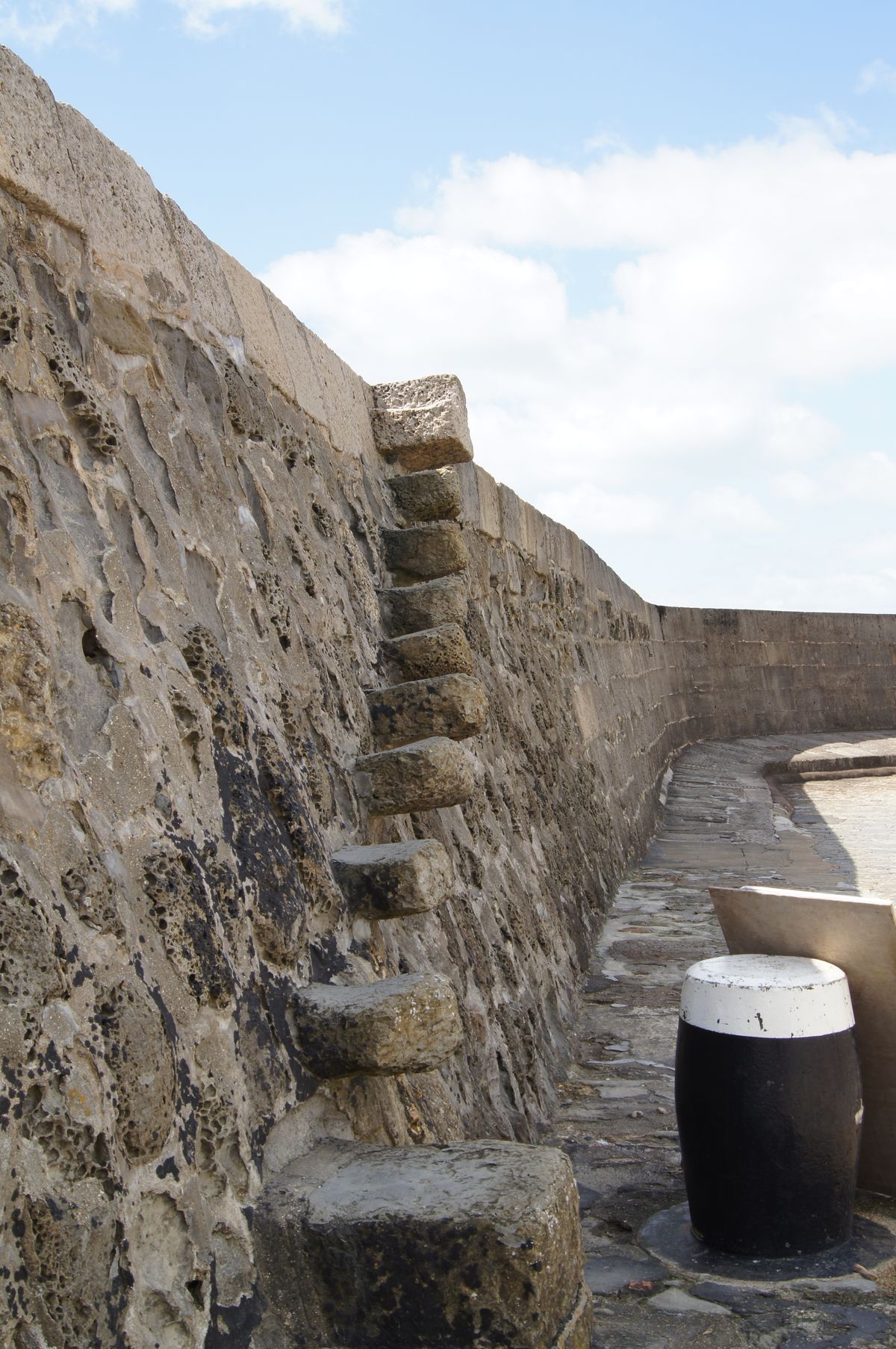 steps going up the side of harbour wall