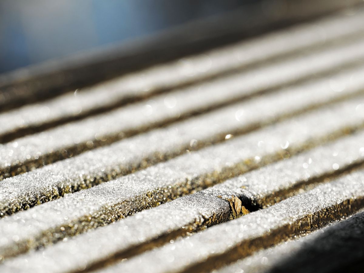 frozen railing diagonally composed with pov on knot