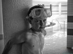 Portrait of a boy posing at the pool.