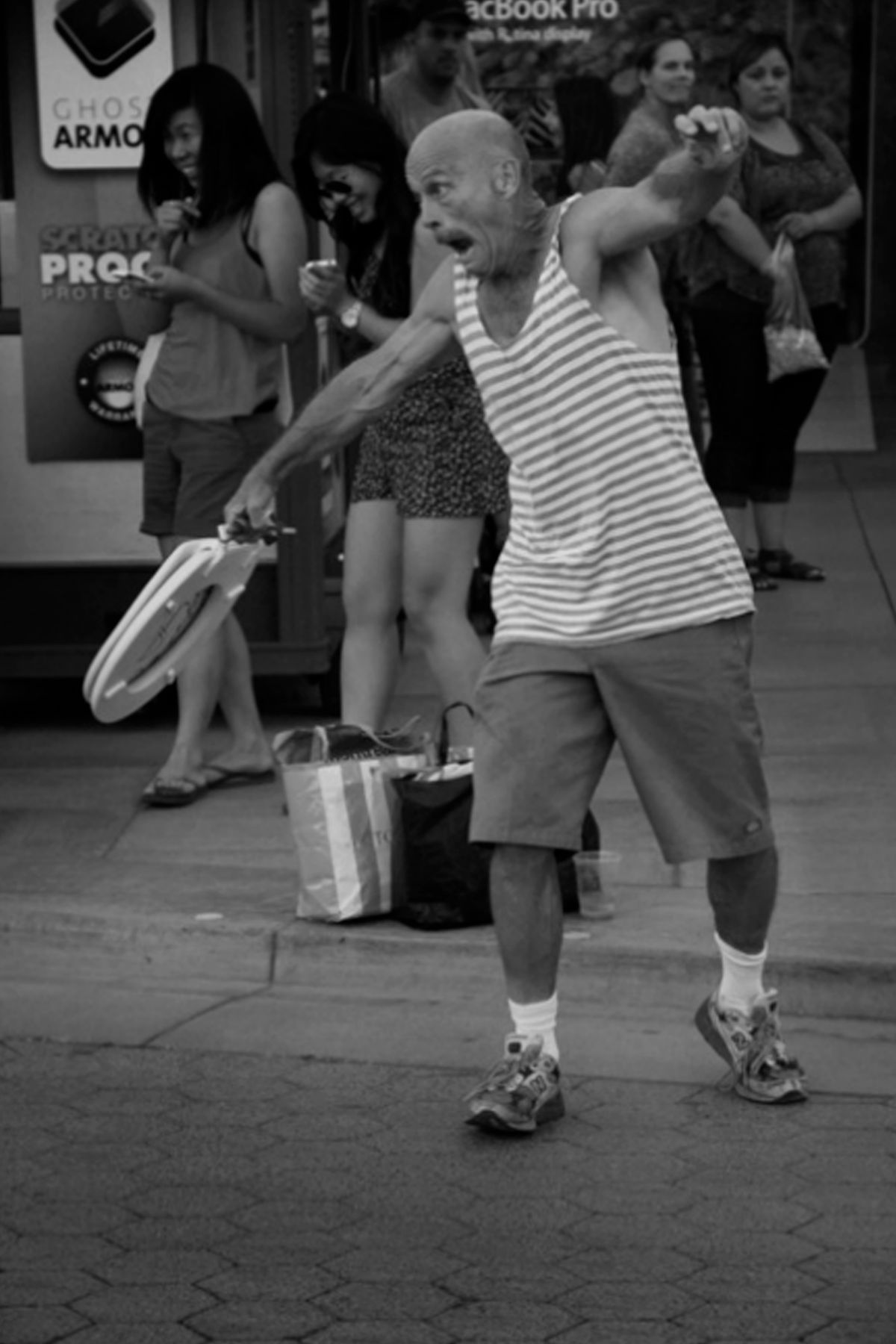 While travelling through Los Angeles, I passed by the local dancer, who was dancing with... a toilet seat. 